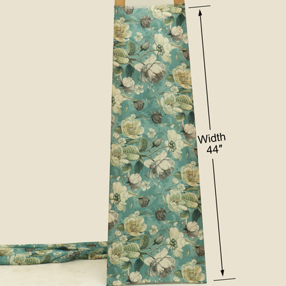 A floral fabric panel or curtain shown hanging vertically with a width measurement annotation reading 44 inches. The fabric has a teal background with large cream, white, and muted green floral print.
