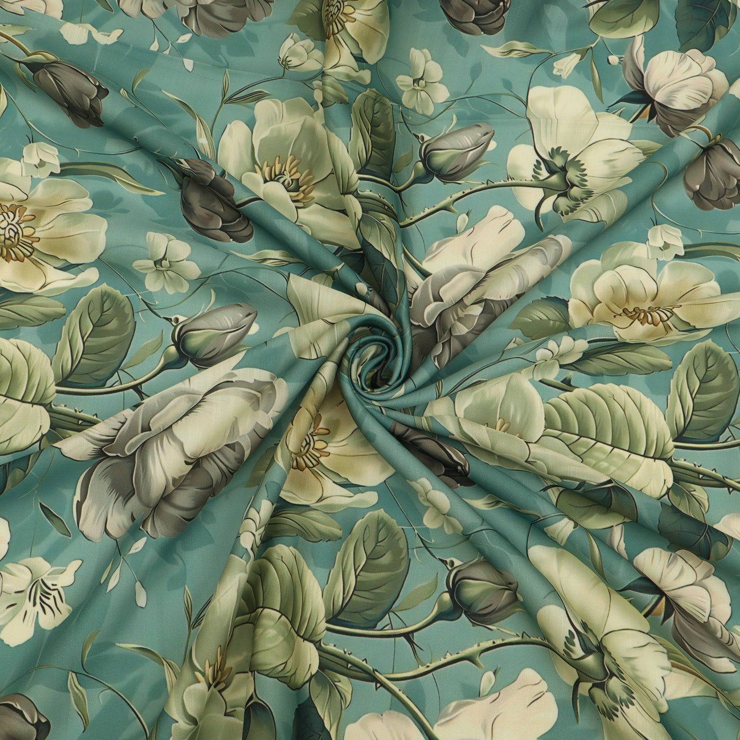 A close-up of a floral fabric with a swirling, gathered center, featuring large cream-colored blossoms, green leaves, and muted gray-brown buds on a teal background.