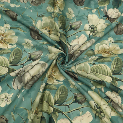 A close-up of a floral fabric with a swirling, gathered center, featuring large cream-colored blossoms, green leaves, and muted gray-brown buds on a teal background.