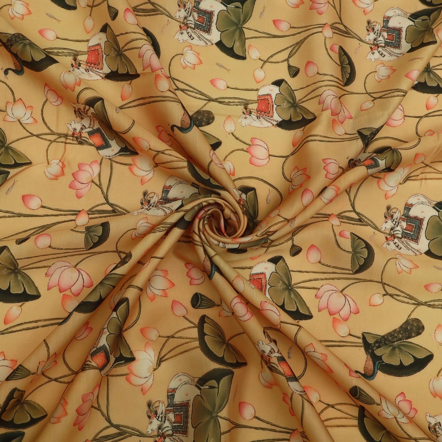 A close-up of draped fabric with a repeating print featuring pink lotus flowers, dark green leaves, and small figures in traditional clothing on a warm beige background.