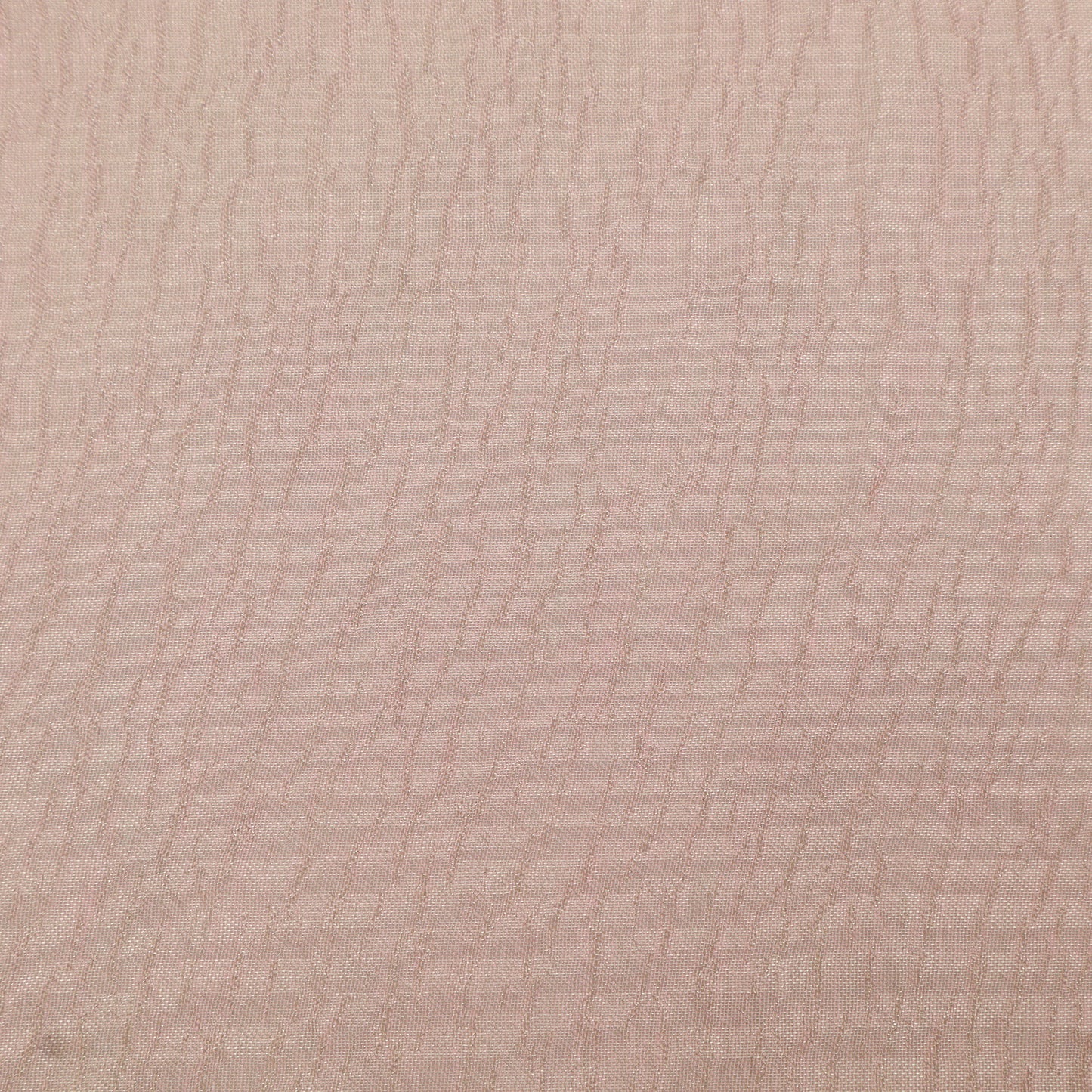 Close-up of a textured beige surface