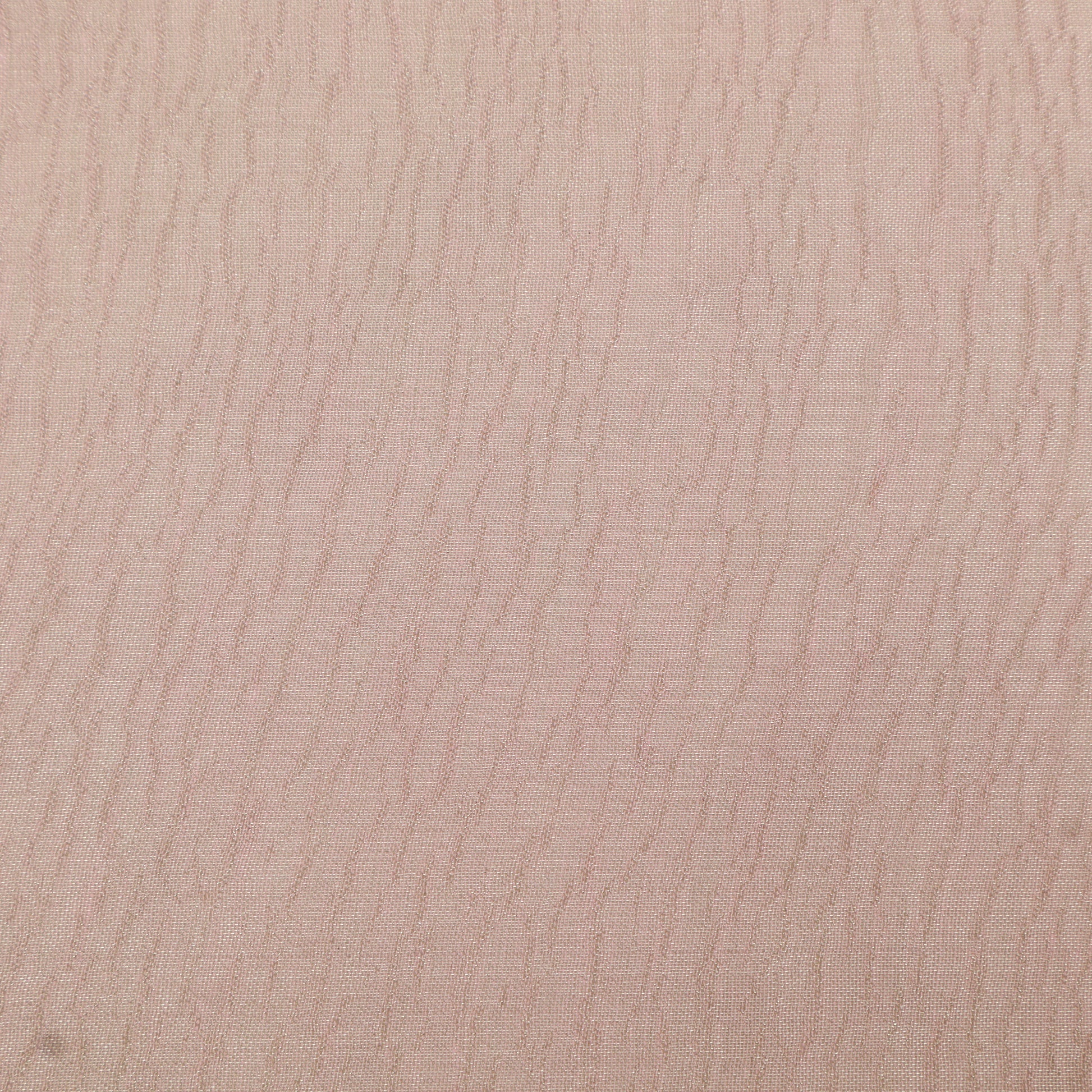 Close-up of a textured beige surface