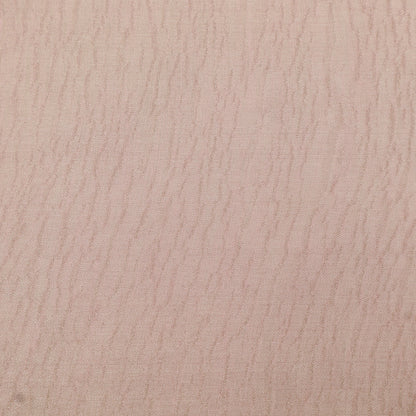 Close-up of a textured beige surface