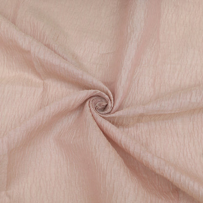 Close-up of pink fabric with a swirl pattern