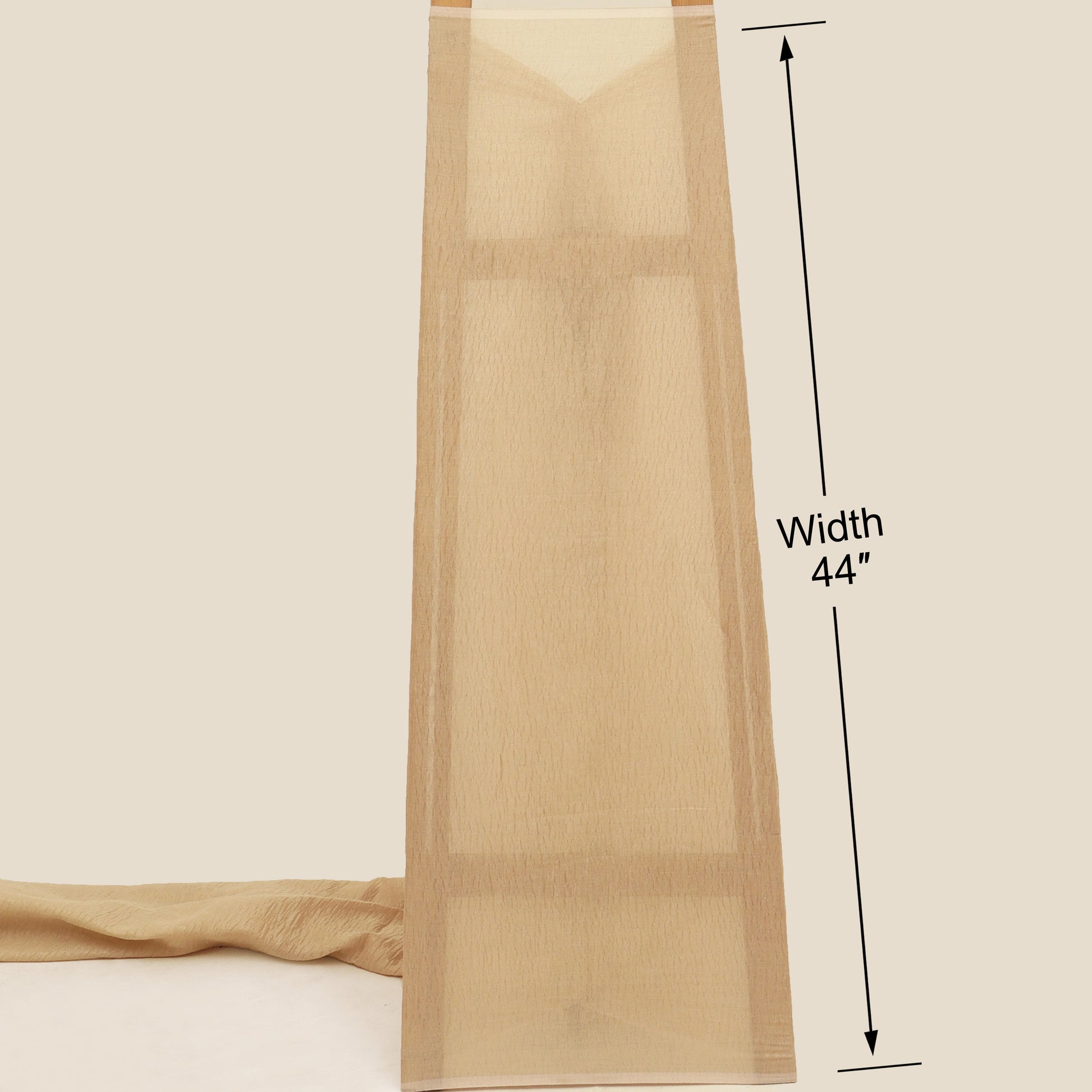 Beige fabric with a measurement label indicating width 44 inches on a beige background