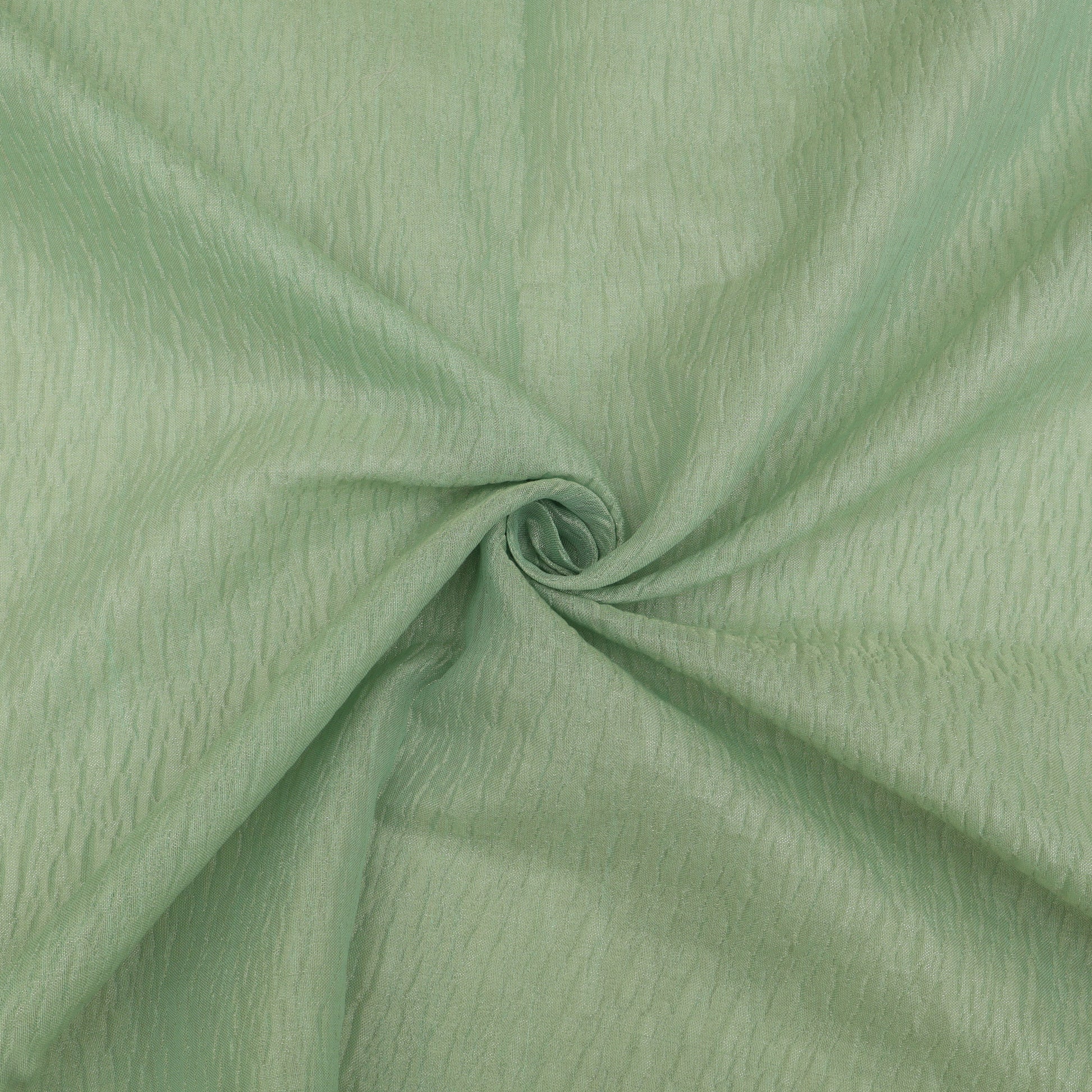 Close-up of green fabric with a slight texture