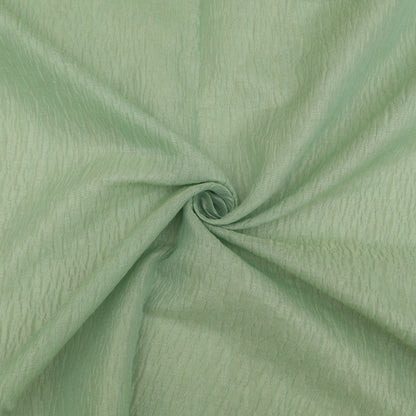 Close-up of green fabric with a slight texture