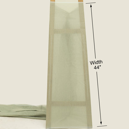 Green fabric with a measurement label indicating width 44 inches on a white background