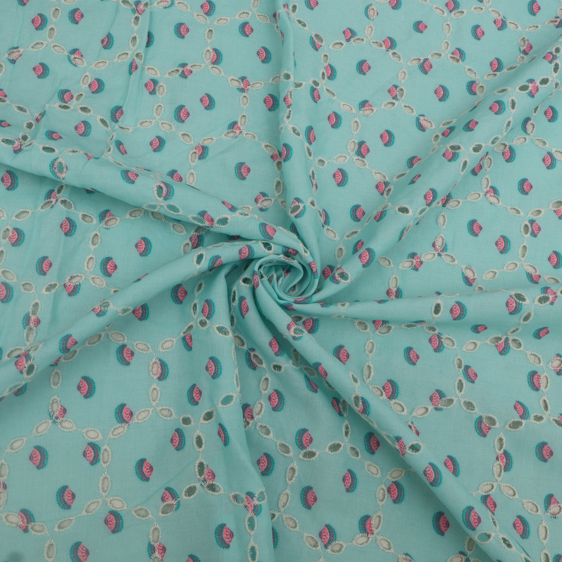Turquoise fabric with small pink and green pattern