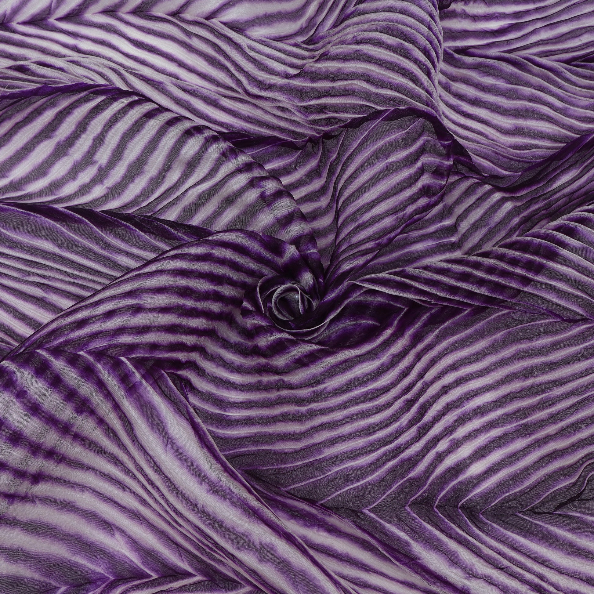 Purple and gray striped fabric with a swirl pattern