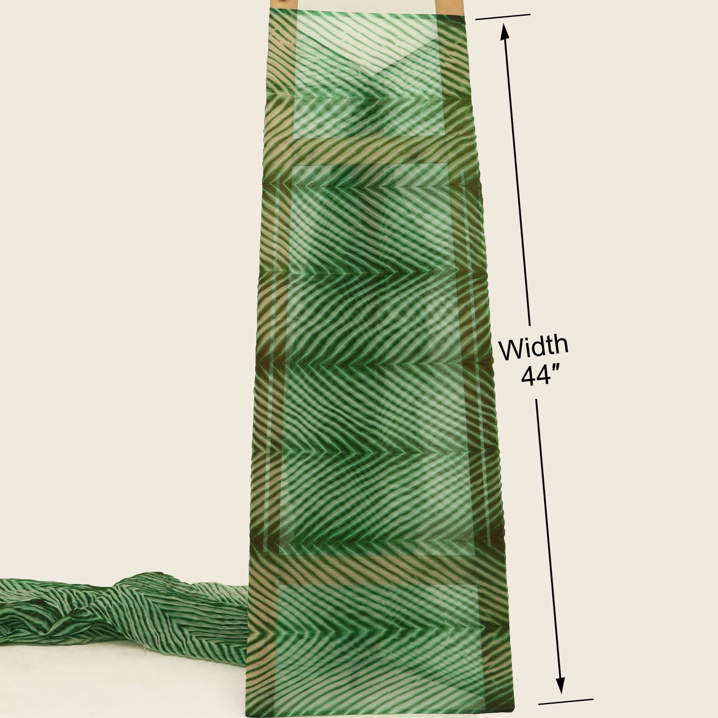 Green fabric with a pattern, displayed on a white background with measurements indicated.