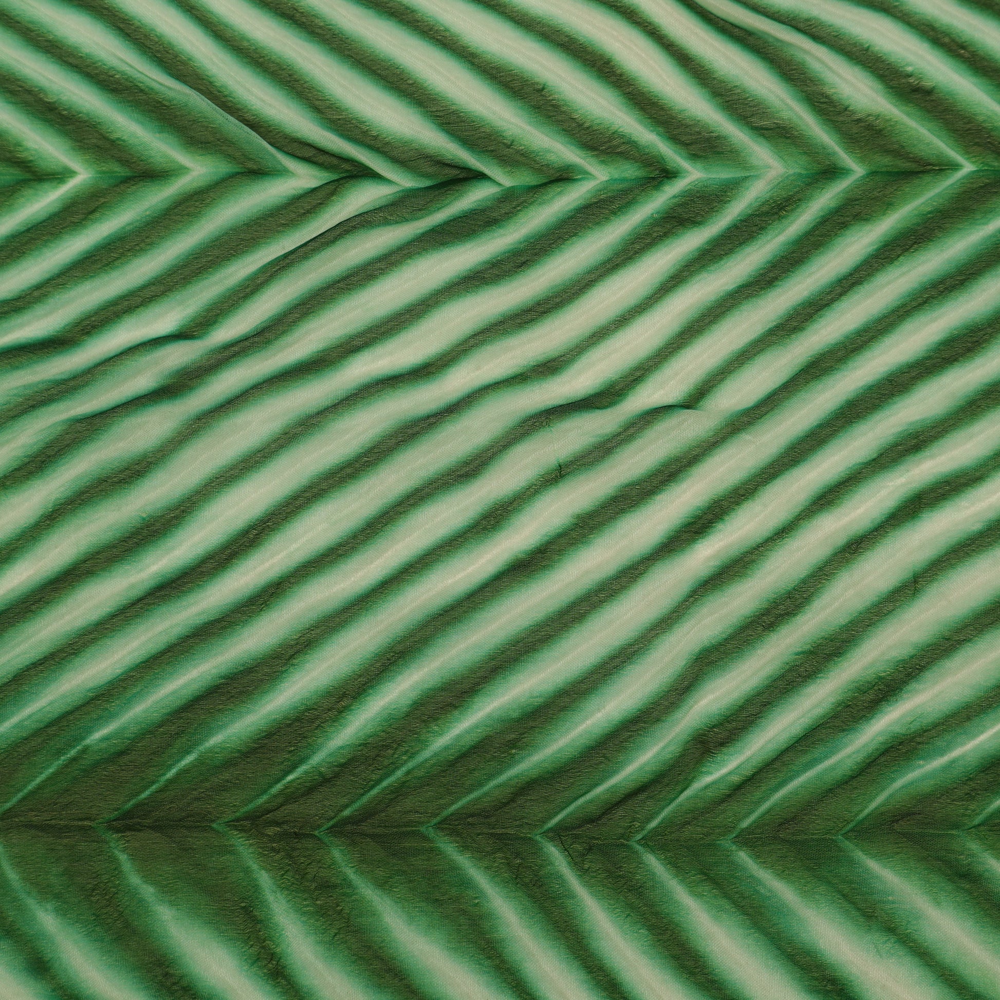 Close-up of green textured surface with wavy pattern