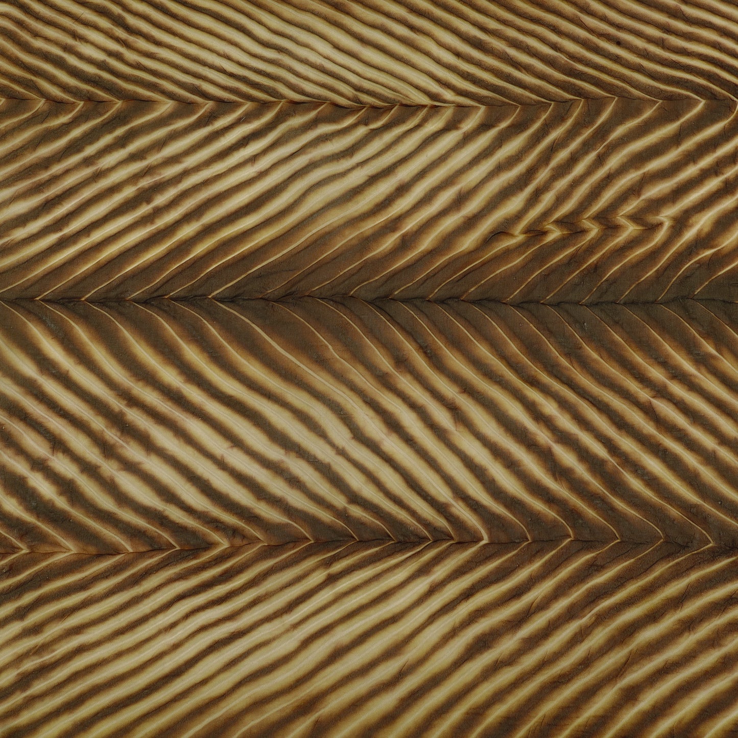 Close-up of sand dunes with a wavy pattern