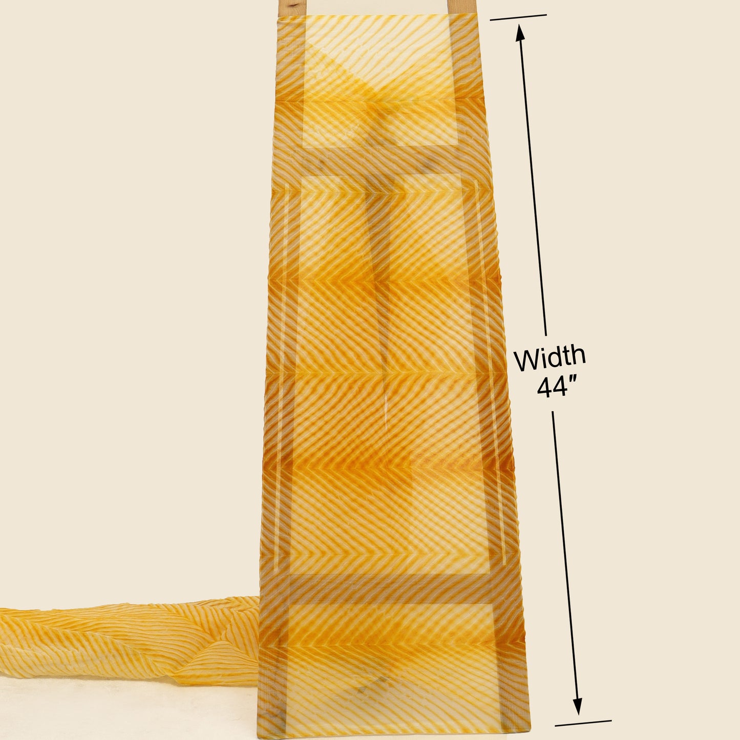 Yellow fabric with a pattern, displayed on a beige background with a measurement label.