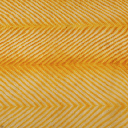 Pattern of yellow chevron lines on a textured background