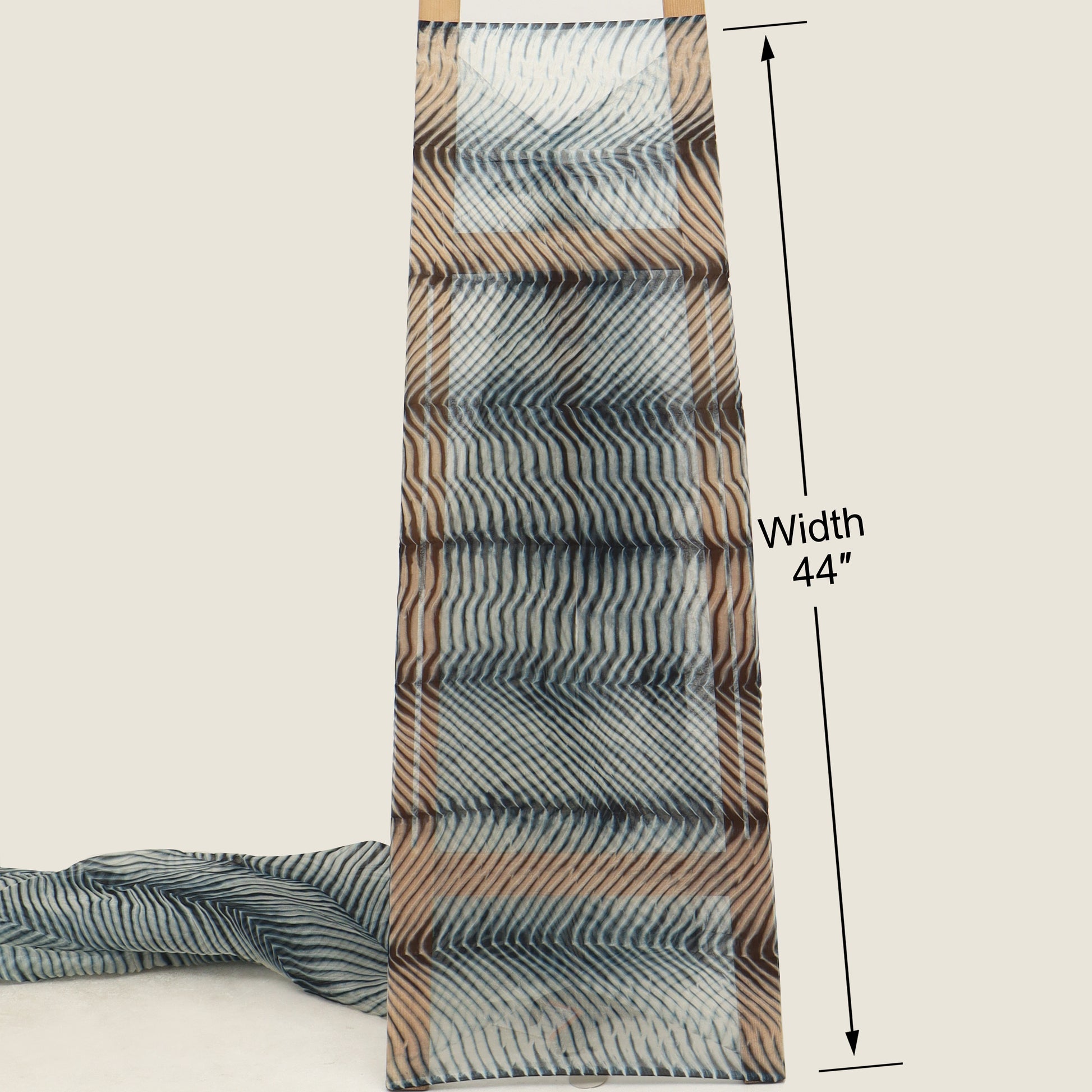 Patterned fabric with dimensions indicated on a beige background