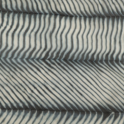Textured fabric with wavy pattern in gray tones