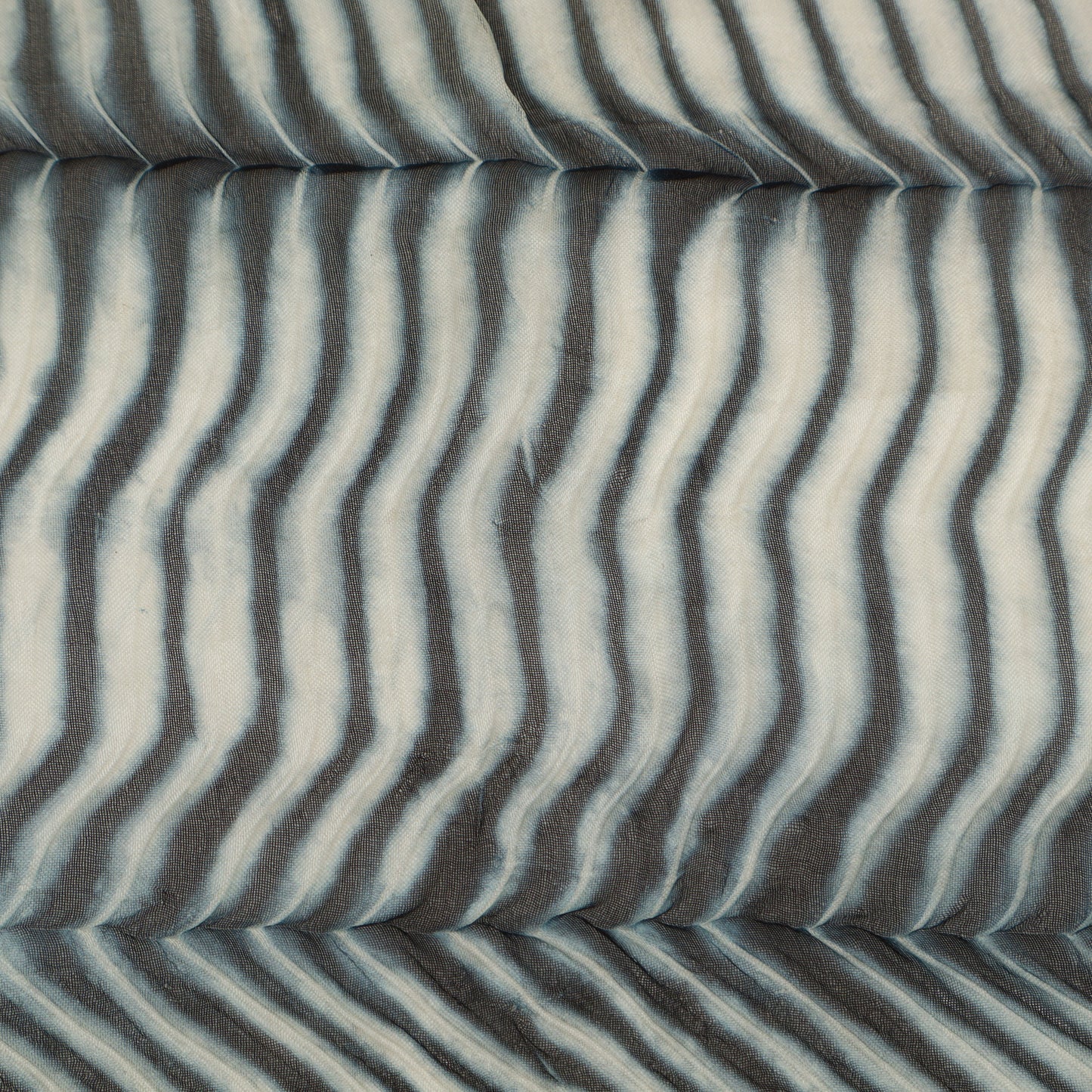 Fabric with wavy gray and white pattern