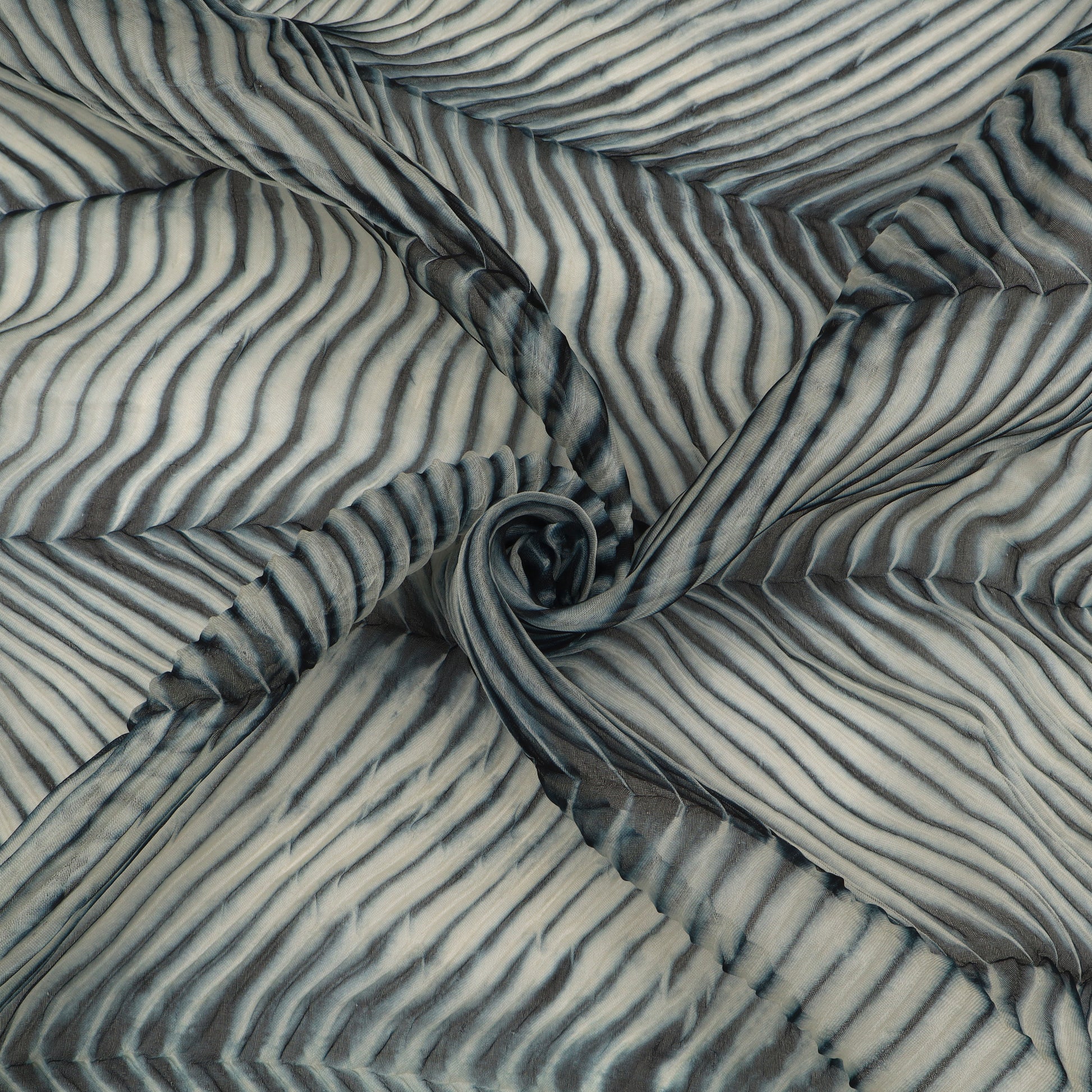 Textured fabric with wavy pattern in gray and white