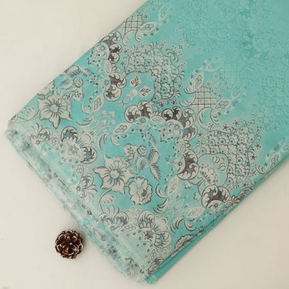 Turquoise fabric with floral and paisley pattern on a white background