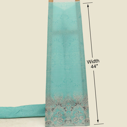 Turquoise fabric with decorative border and measurement label on a beige background