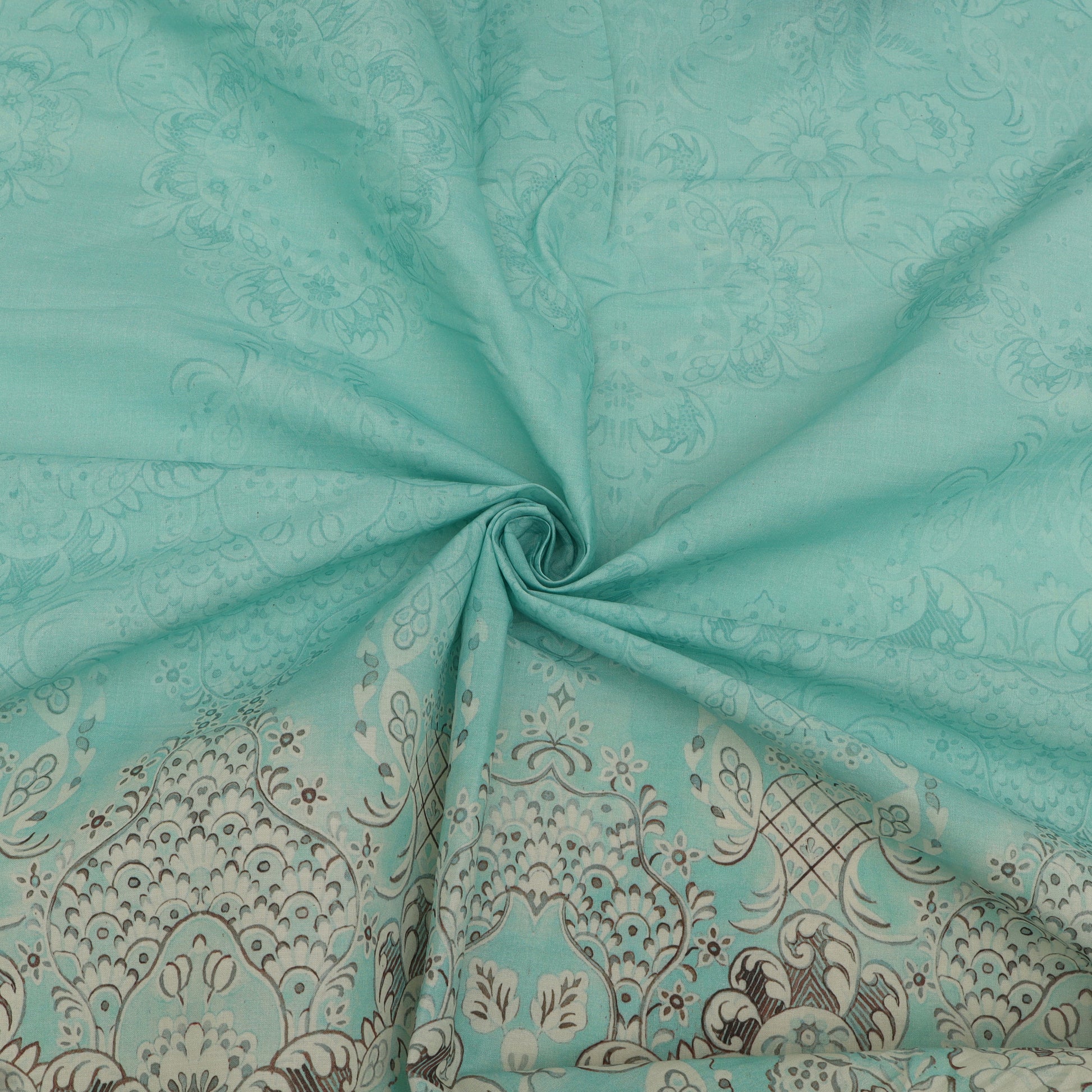 Turquoise fabric with intricate paisley pattern