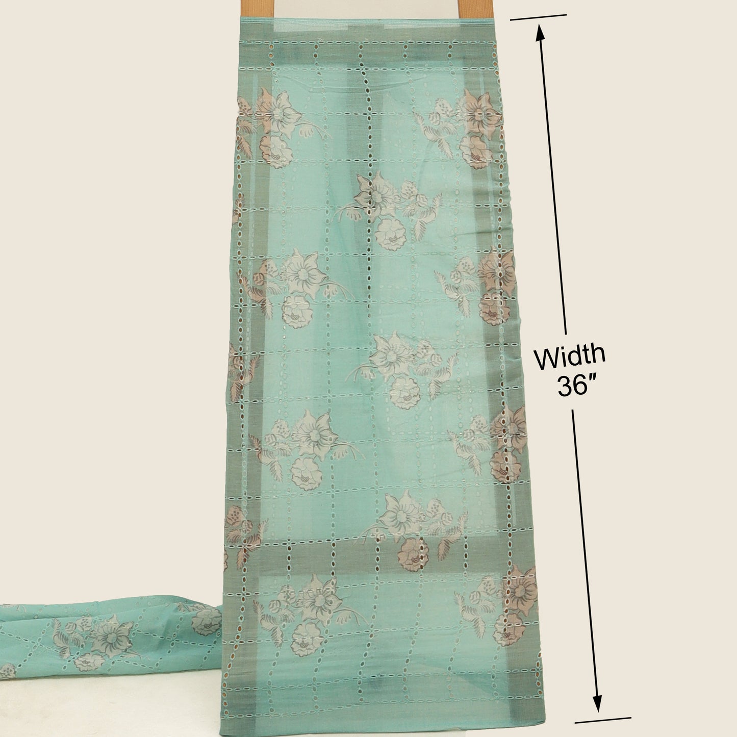 Teal fabric with floral patterns and measurements on a white background