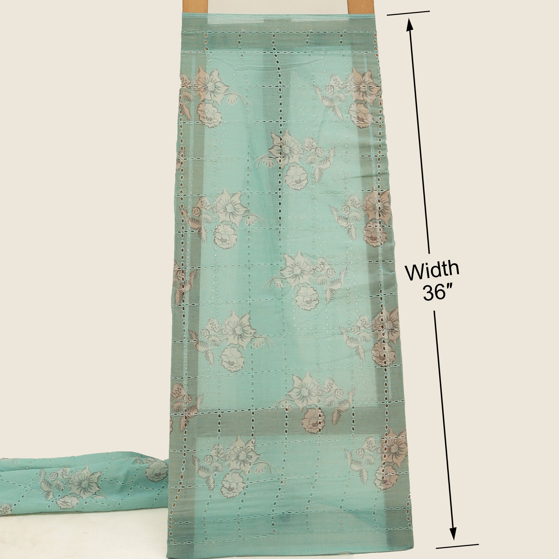 Teal fabric with floral patterns and measurements on a white background