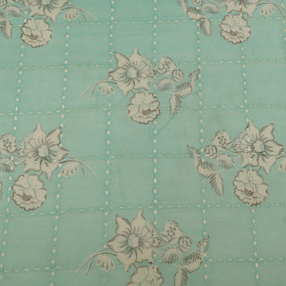 Floral pattern on a teal background with grid lines