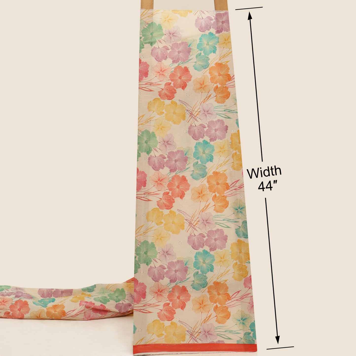 Floral-patterned fabric with a width measurement of 44 inches on a beige background