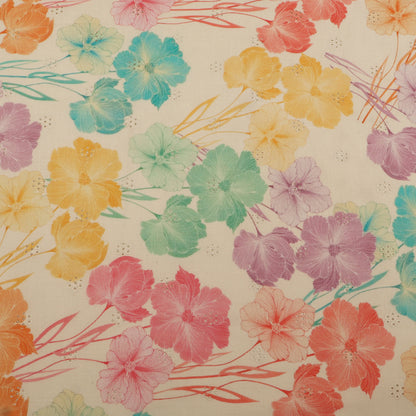 Close-up of a textured fabric with a leaf pattern on a blue background