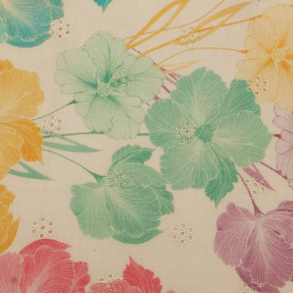 Floral pattern with green, yellow, and pink flowers on a beige background