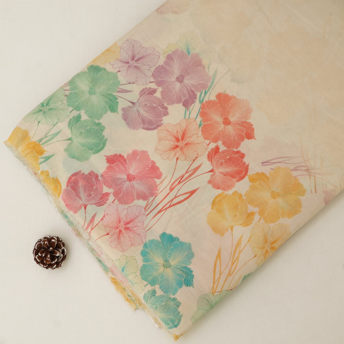 Floral-patterned fabric with colorful flowers on a plain background
