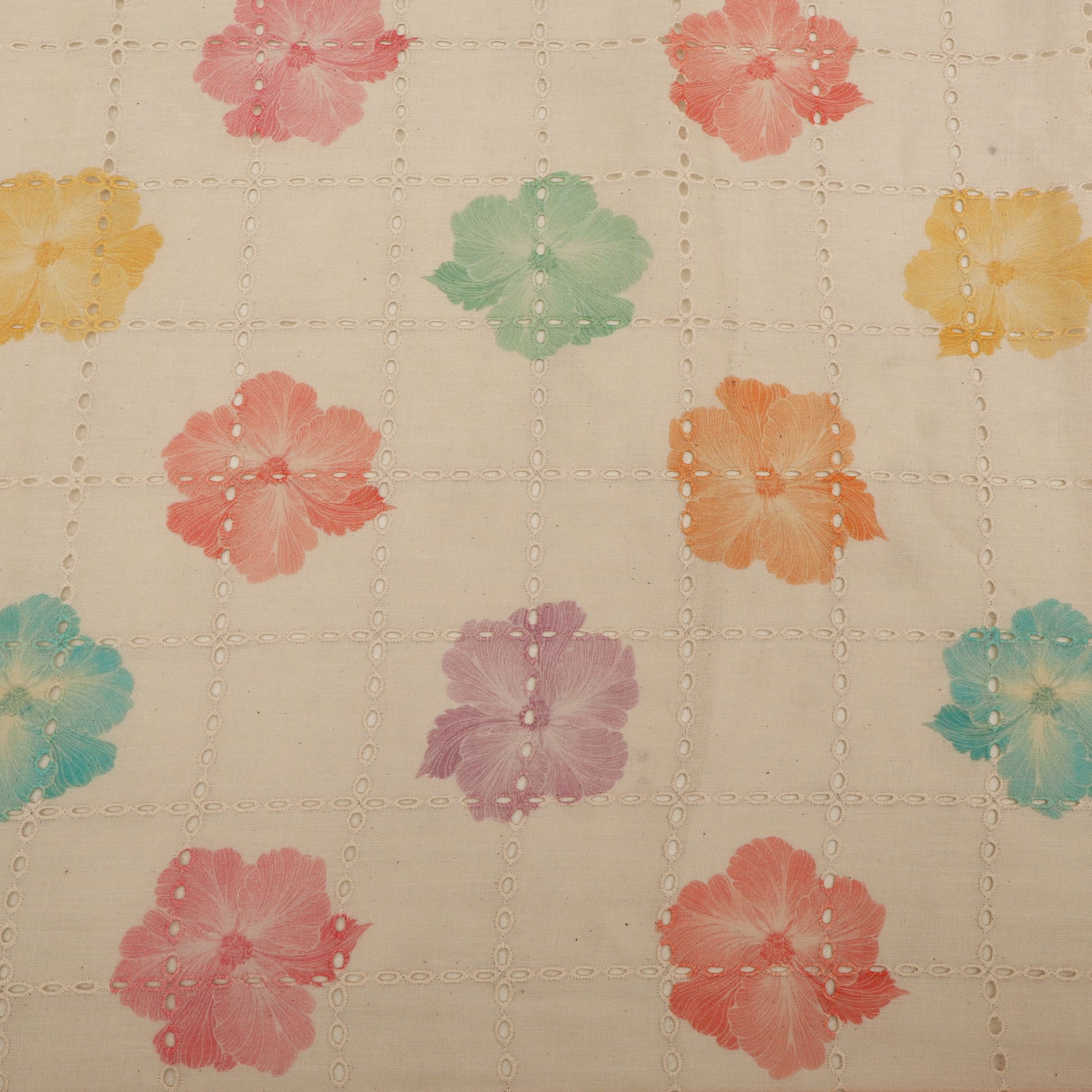 Patterned fabric with colorful flowers on a beige background