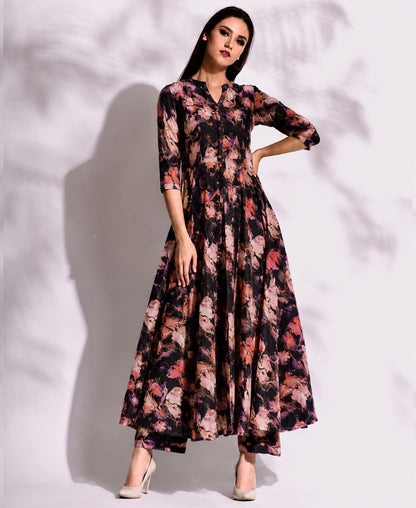 Woman wearing a floral dress against a white background
