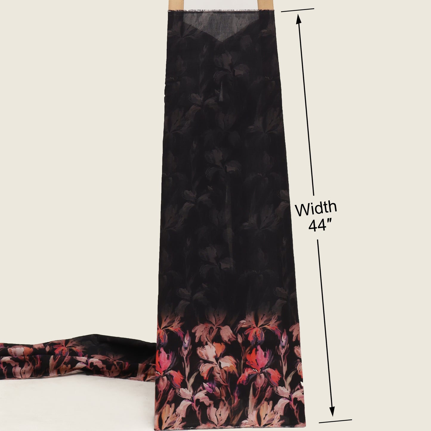 Black floral patterned fabric with a measurement label on a white background
