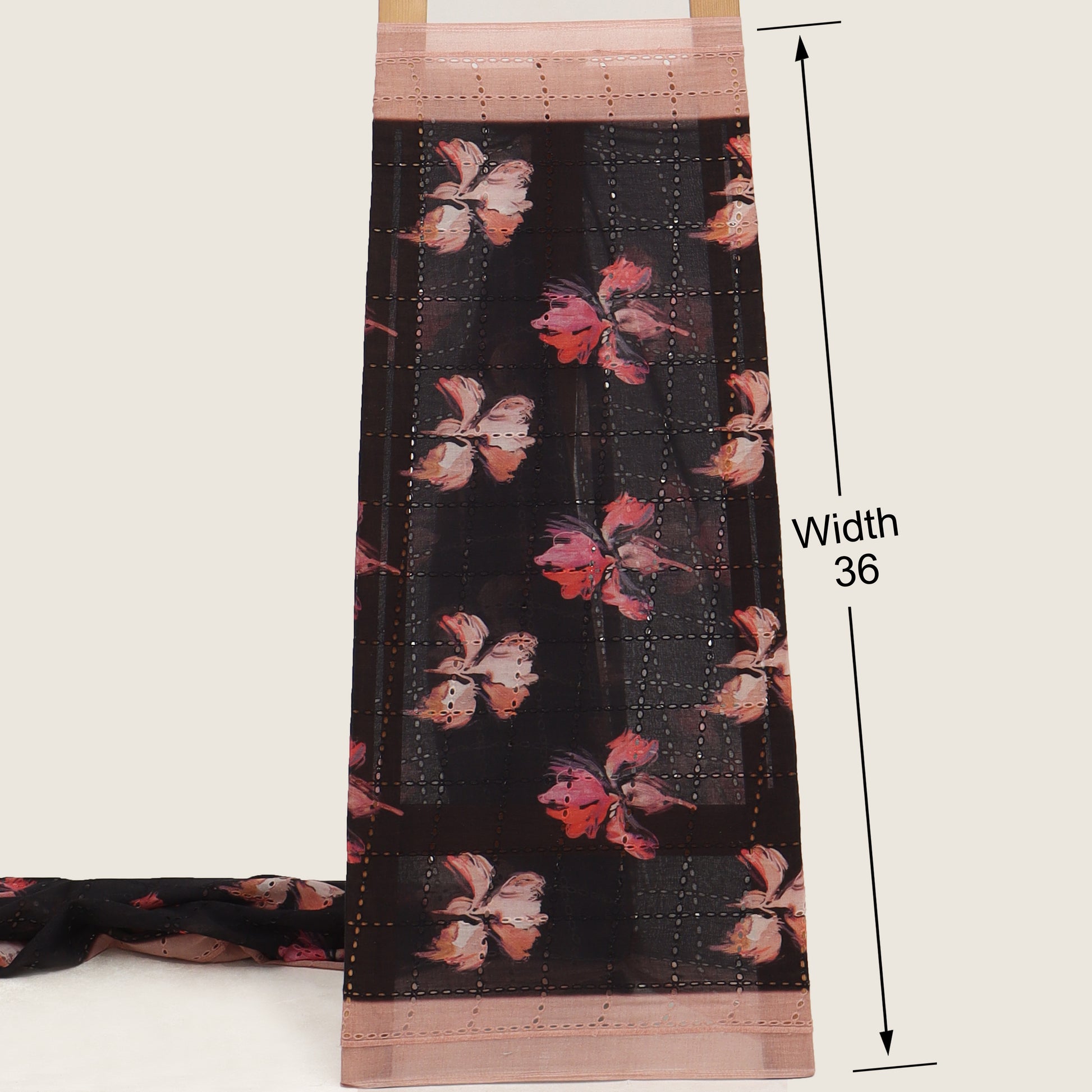 Fabric swatch with floral pattern and measurement details on a white background