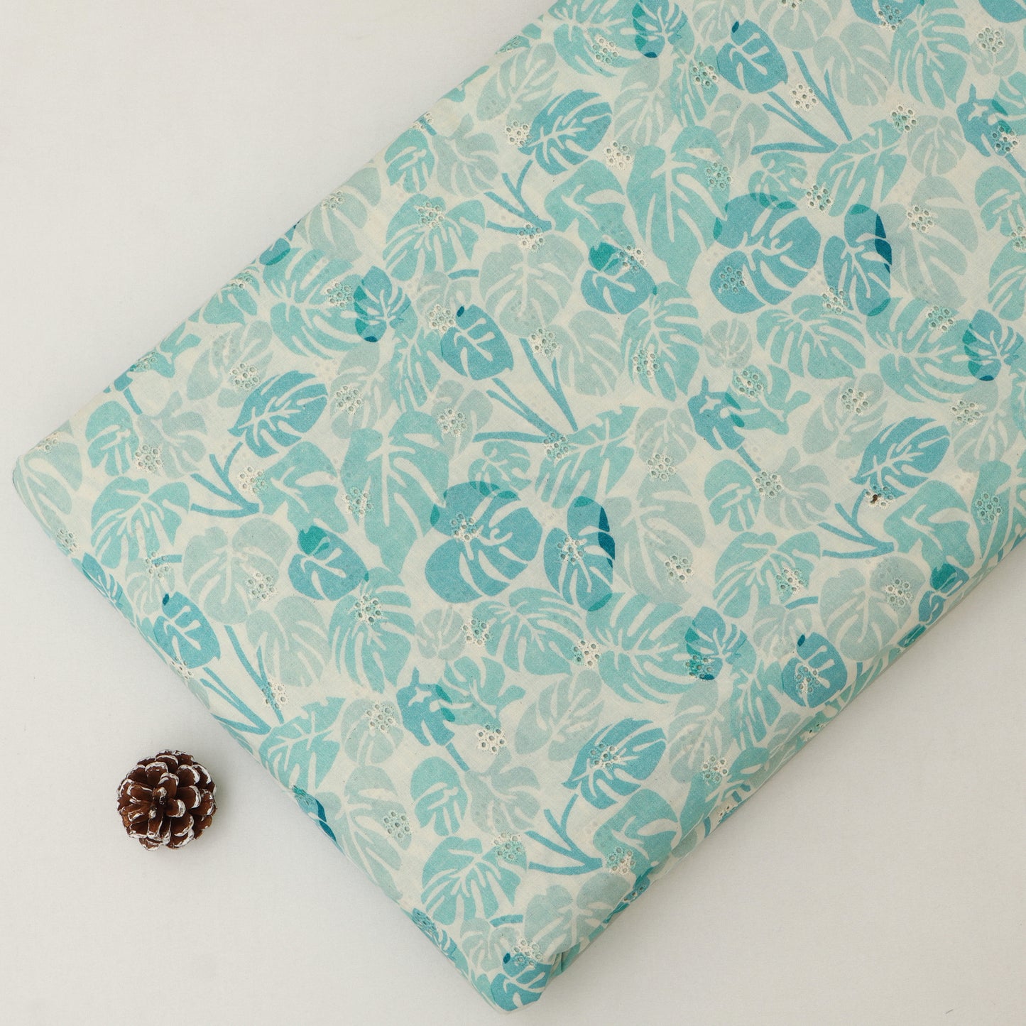 Patterned fabric with floral design on a blue background