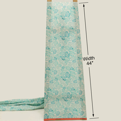 Teal floral patterned fabric with a measurement label on a beige background