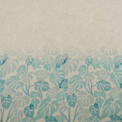 Patterned fabric with blue leaf design on a beige background