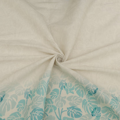 Close-up of beige fabric with a turquoise leaf pattern