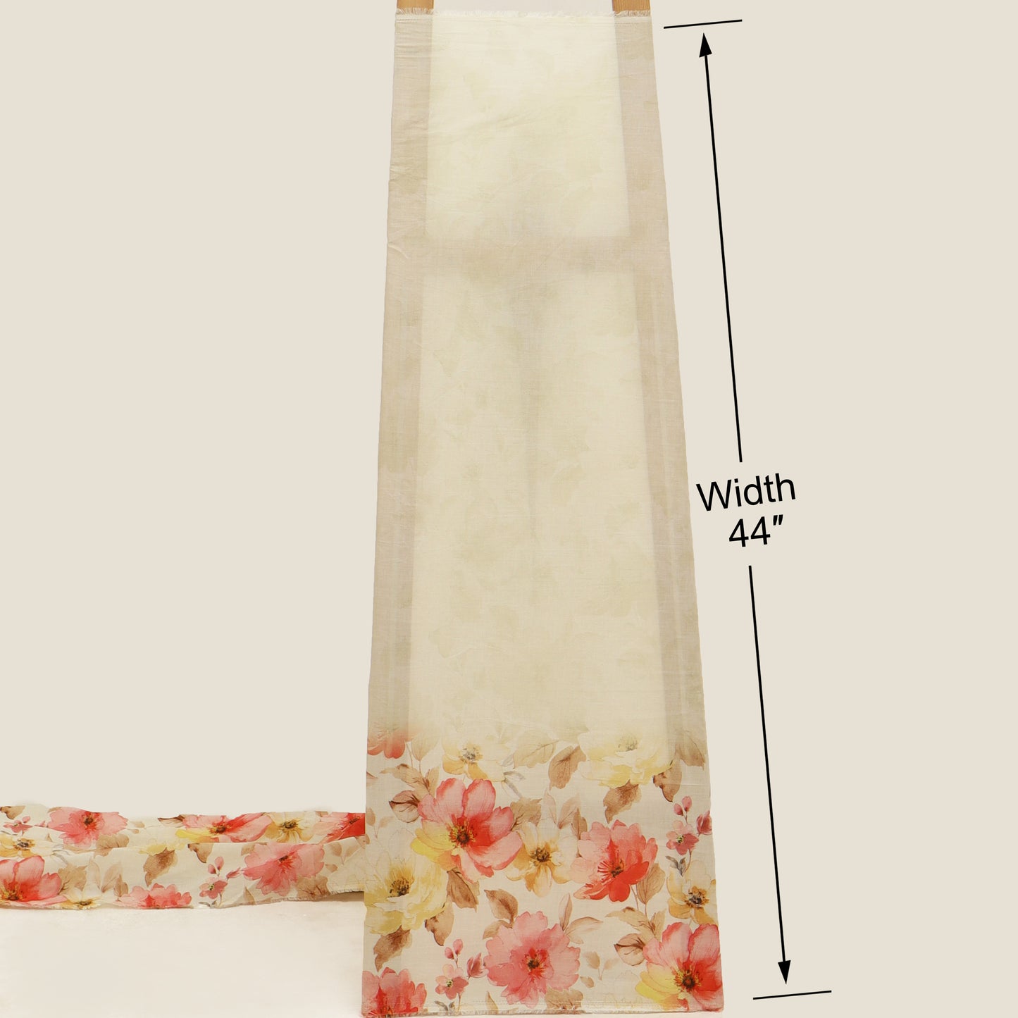 Floral fabric strip with measurement label on a beige background