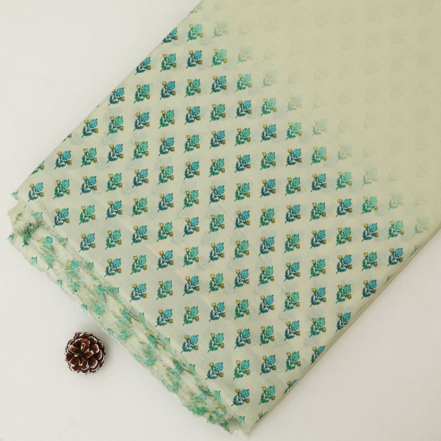 Folded fabric with a floral pattern on a white background