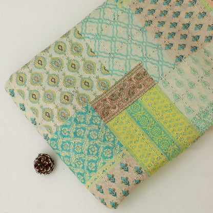 Patchwork fabric with geometric and floral patterns on a white background