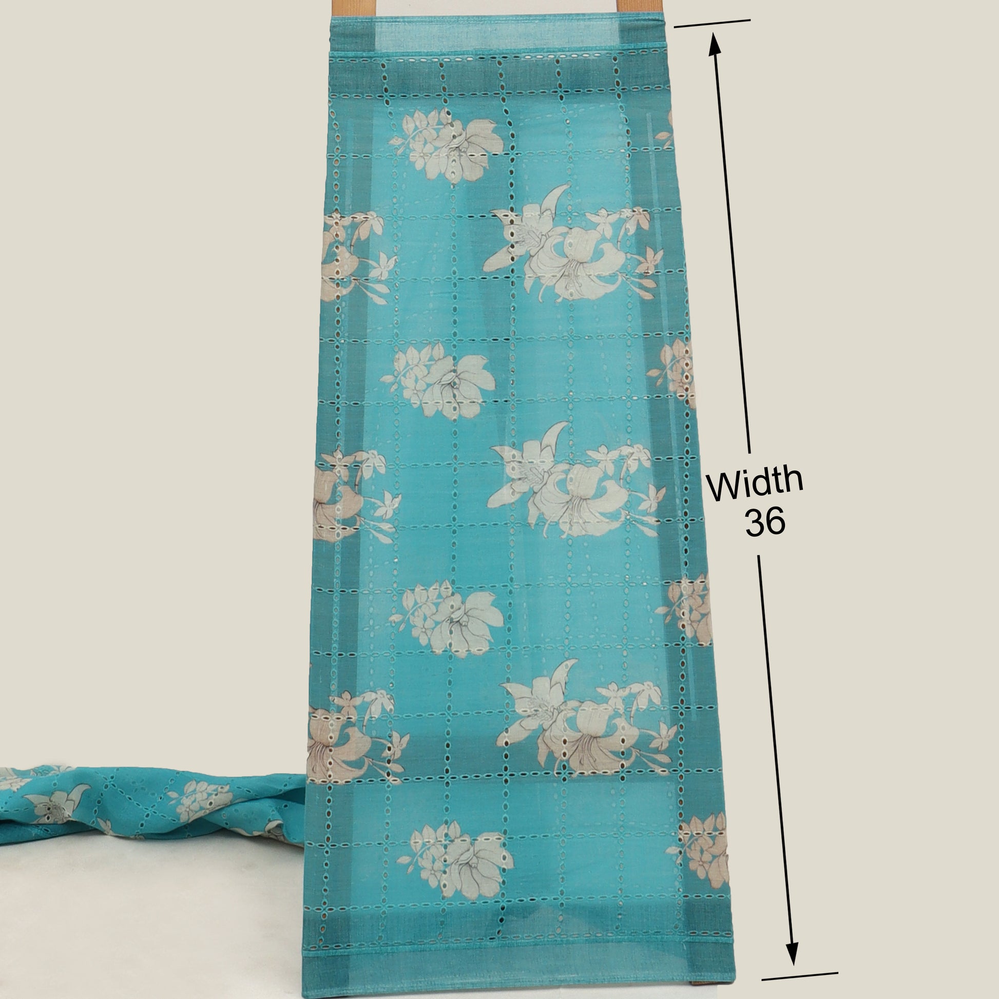 Blue fabric with floral pattern and measurement details on a white background