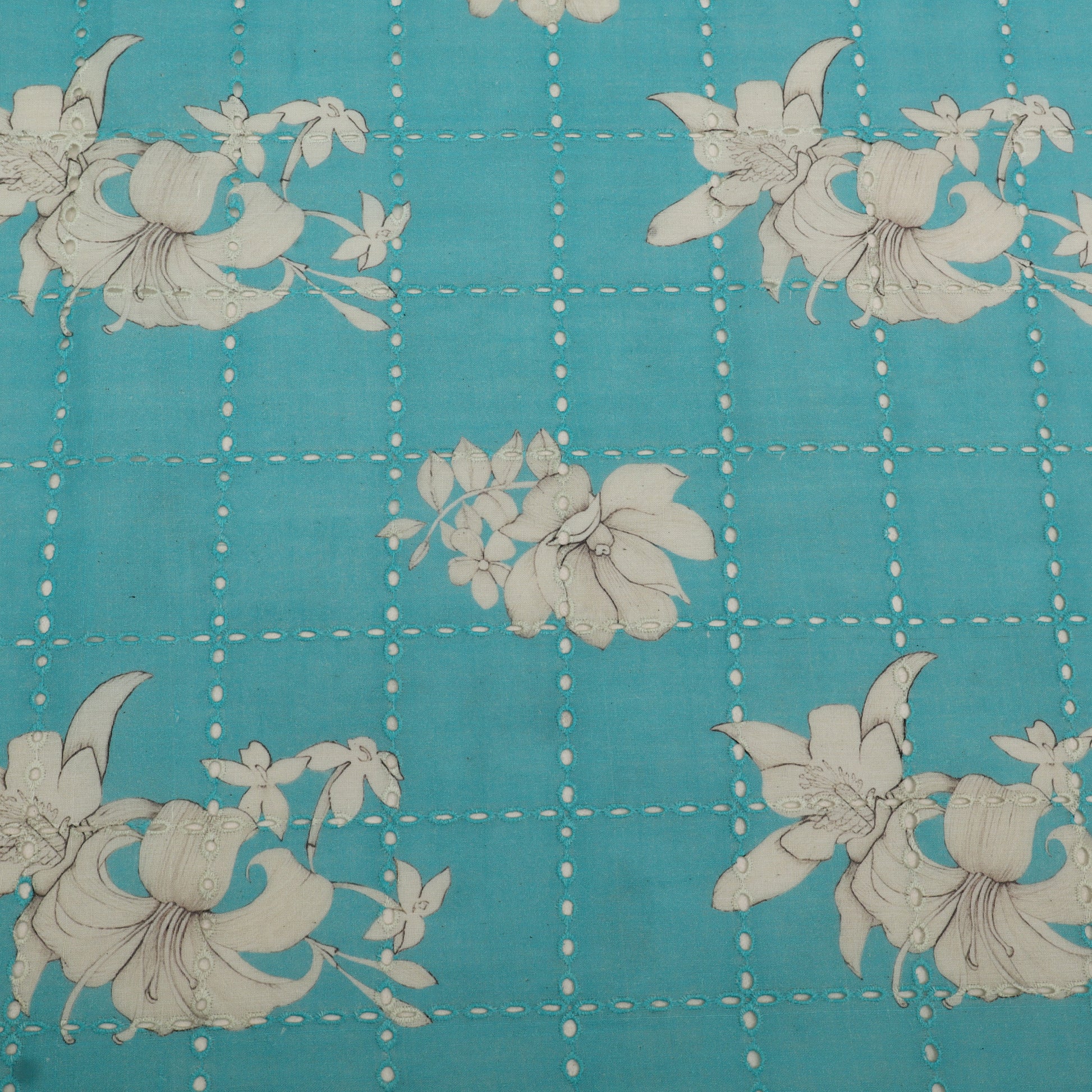 Floral pattern on a blue background with white grid lines