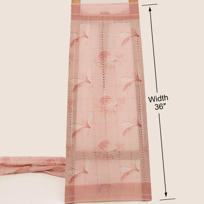Pink floral patterned fabric with a measurement label on a beige background