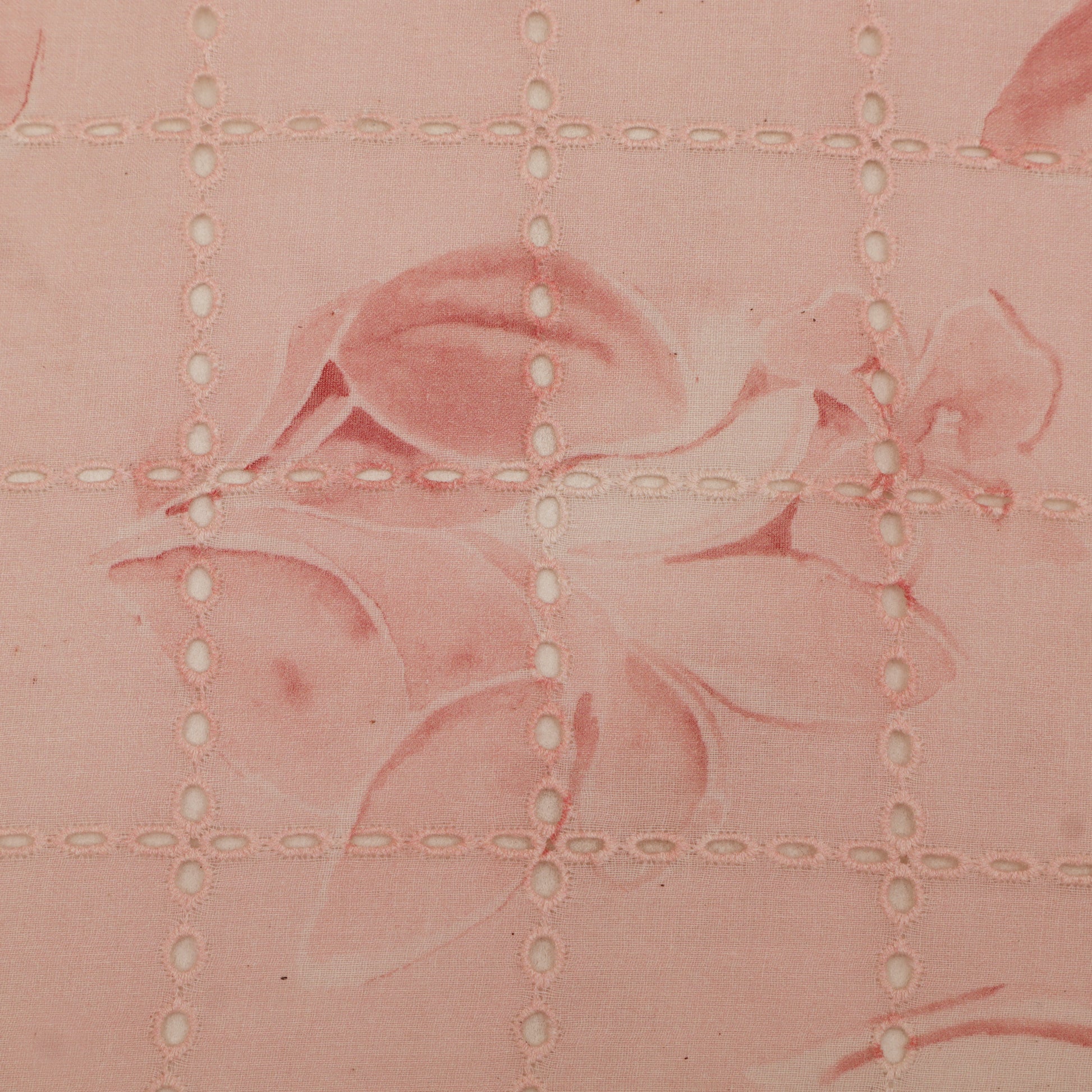 Pink floral pattern with grid lines on a textured background