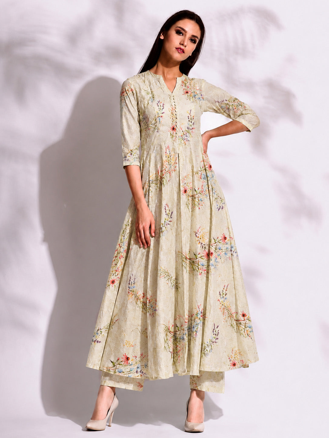 Woman wearing a floral dress on a white background