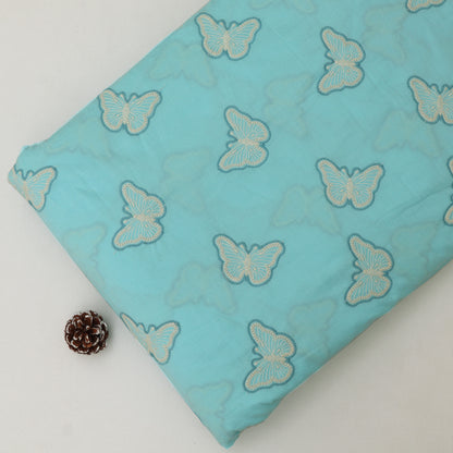 Turquoise fabric with butterfly patterns on a white background
